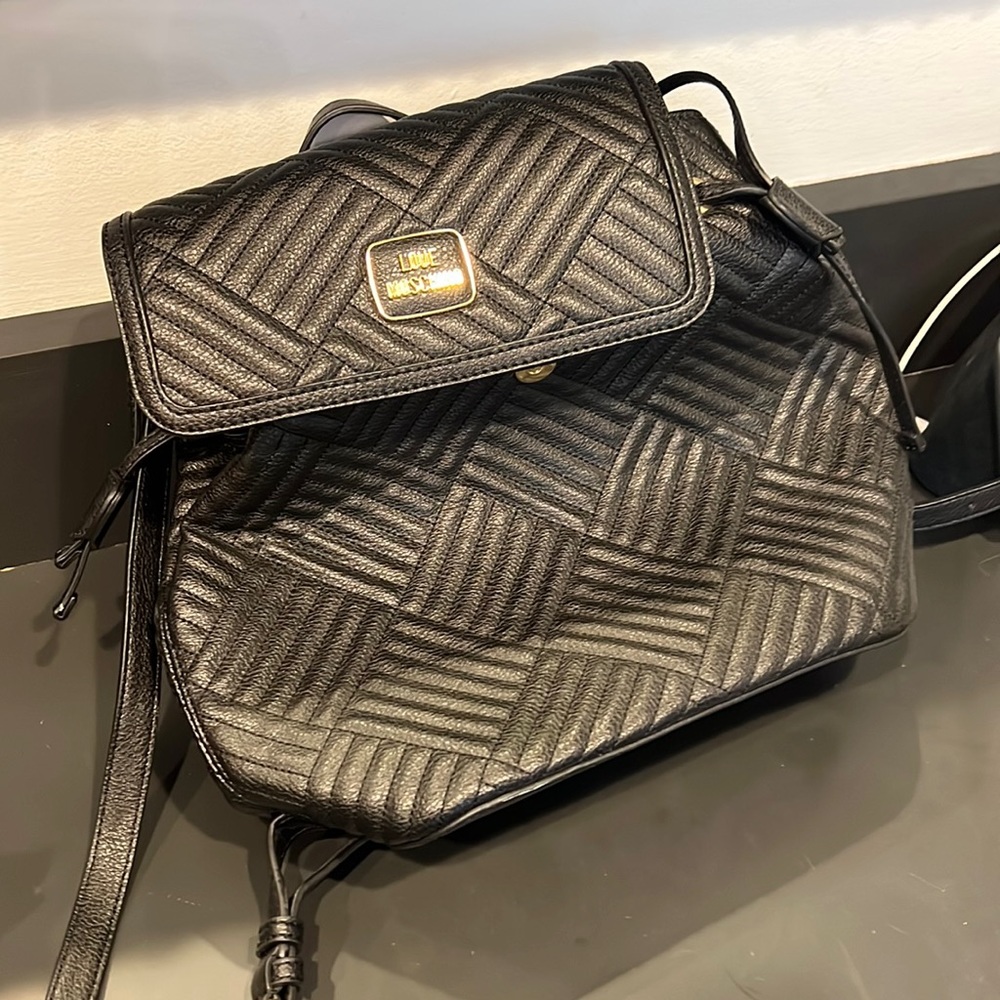Black leather Love Machino backpack with gold details